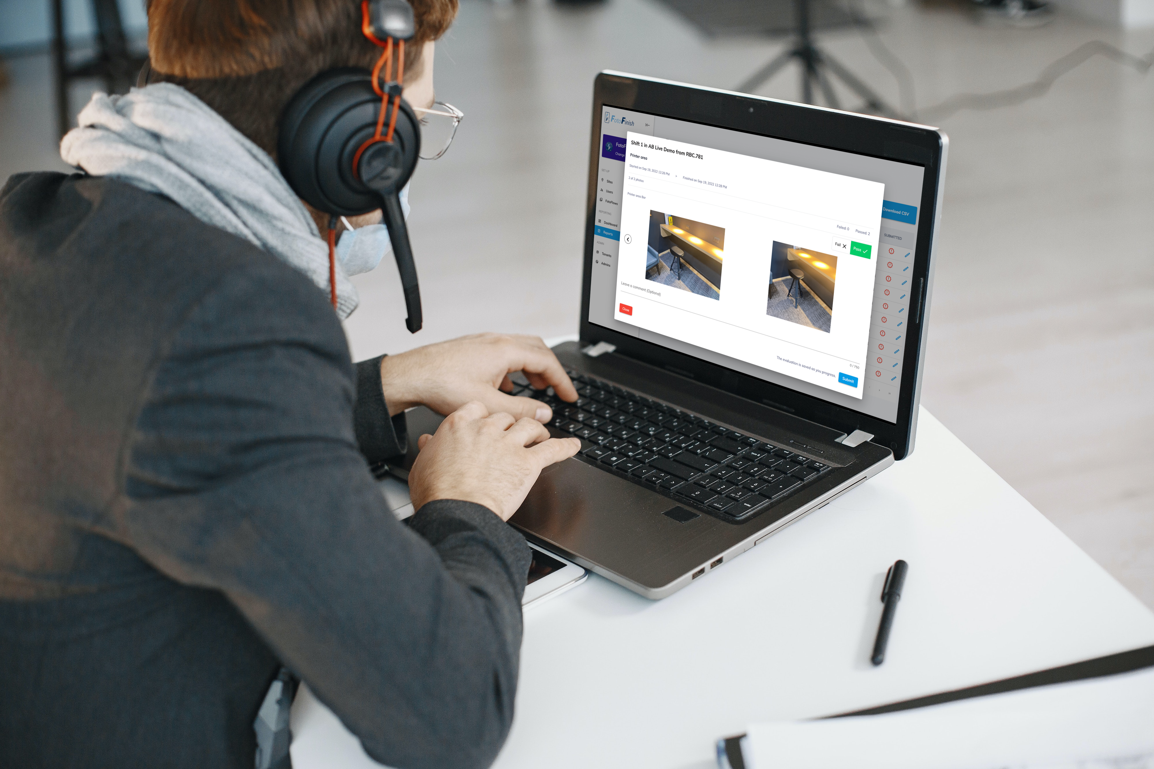 FotoFinish Evaluation Center specialist reviewing photo reports on a laptop with headphones